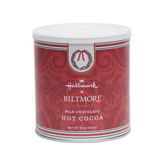 A cylindrical 16 oz metal canister of Hallmark x Biltmore Milk Chocolate Hot Cocoa, featuring a festive red label with a white lid, on a solid white background.