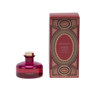 Archipelago Cranberry diffuser bottle shown next to its decorative red and gold packaging box on a plain white background.