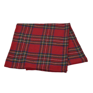A folded red tartan plaid table runner with thin green, yellow, and white intersecting stripes, shown on a plain white background.