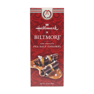 A 3.5 oz bar of Hallmark x Biltmore Sea Salt Caramel chocolate, in its red patterned packaging, shown against a plain white background.