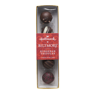 A boxed set of five Hallmark x Biltmore European Truffles in a clear plastic package with a red label and gold trim, shown on a white background.