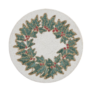 A round braided placemat featuring a green holly wreath with red berries on a white background.