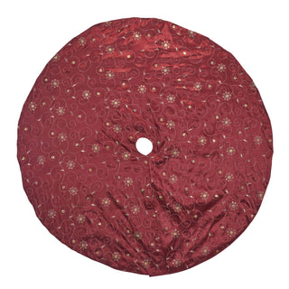 A round tree skirt made of deep burgundy satin fabric, decorated with gold and beige floral and swirl patterns, shown against a plain white background.