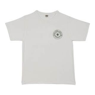An off-white short-sleeve crewneck t-shirt with a circular green-and-black Biltmore Grown honey logo printed on the left chest, displayed flat against a white background.