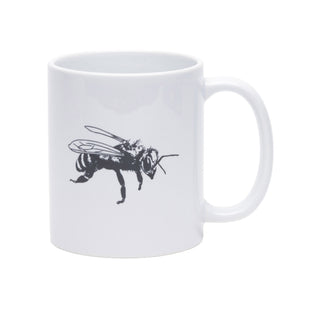 A white ceramic mug featuring a black line-art illustration of a bee on the side, set against a plain white background.