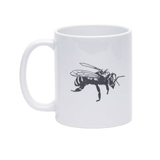 A white ceramic coffee mug featuring a black line-art illustration of a bee on the side, set against a plain white background.