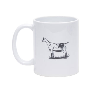 A white ceramic coffee mug with a black line art illustration of a goat standing on a small patch of grass, shown against a plain white background.