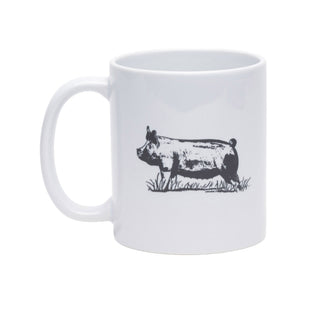 A white ceramic mug featuring a black line-art illustration of a pig standing in grass, shown against a plain white background.