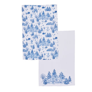 Two white kitchen towels with blue winter landscape prints, featuring a detailed Toile pattern of cabins, snow-covered pine trees, and snowflakes on one towel, and a larger matching towel with a single cabin print layered behind it. Pattern from Hallmark's NEW Biltmore movie.