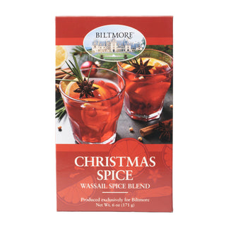 Biltmore Christmas Spice Wassail Spice Blend tea box, featuring festive red packaging with images of iced cocktails garnished with star anise and rosemary.