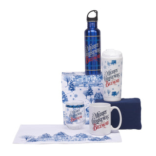 A Christmas-themed collection featuring a blue insulated water bottle, a white tumbler, a white ceramic mug, a steamless wine glass, all decorated with blue winter landscapes and the text 'Merry Christmas from Biltmore'.