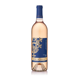 Front of a bottle of Line & Legacy by Biltmore Estate Winery North Carolina Rosé 2025. The bottle features a blue and gold label, and is filled with pinkish-red wine, set against a plain white background.